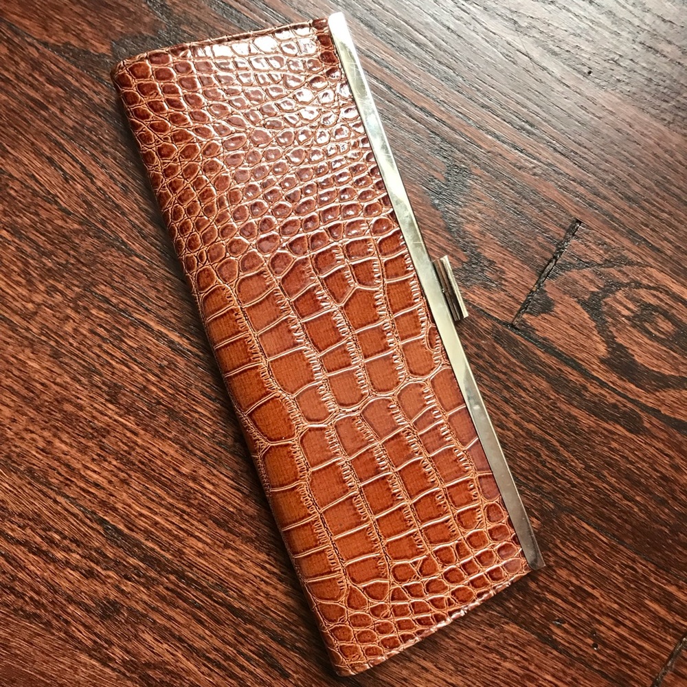 Maroon and tan clutch with reptile embossing